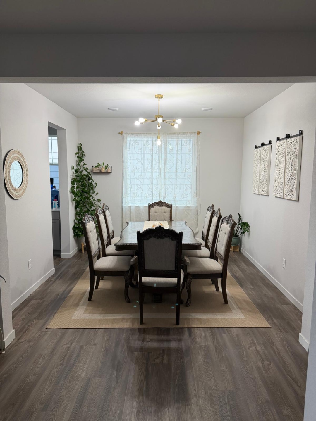 Open-plan living room view with fireplace and mounted television