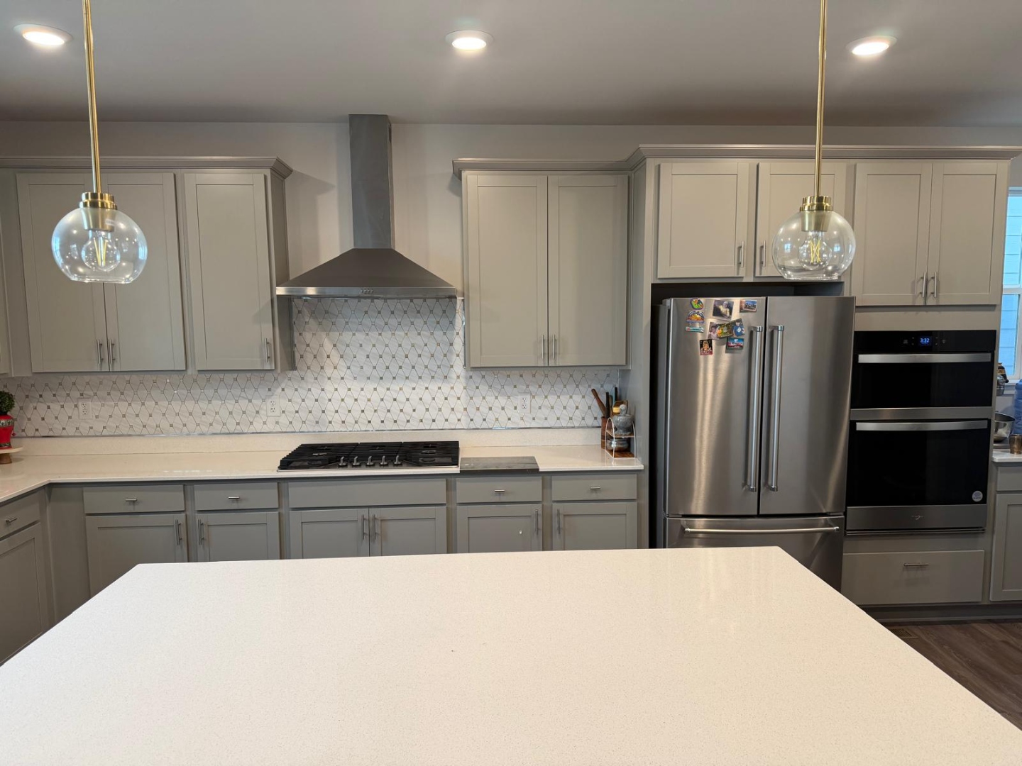 Kitchen island and cabinetry with pendant lighting