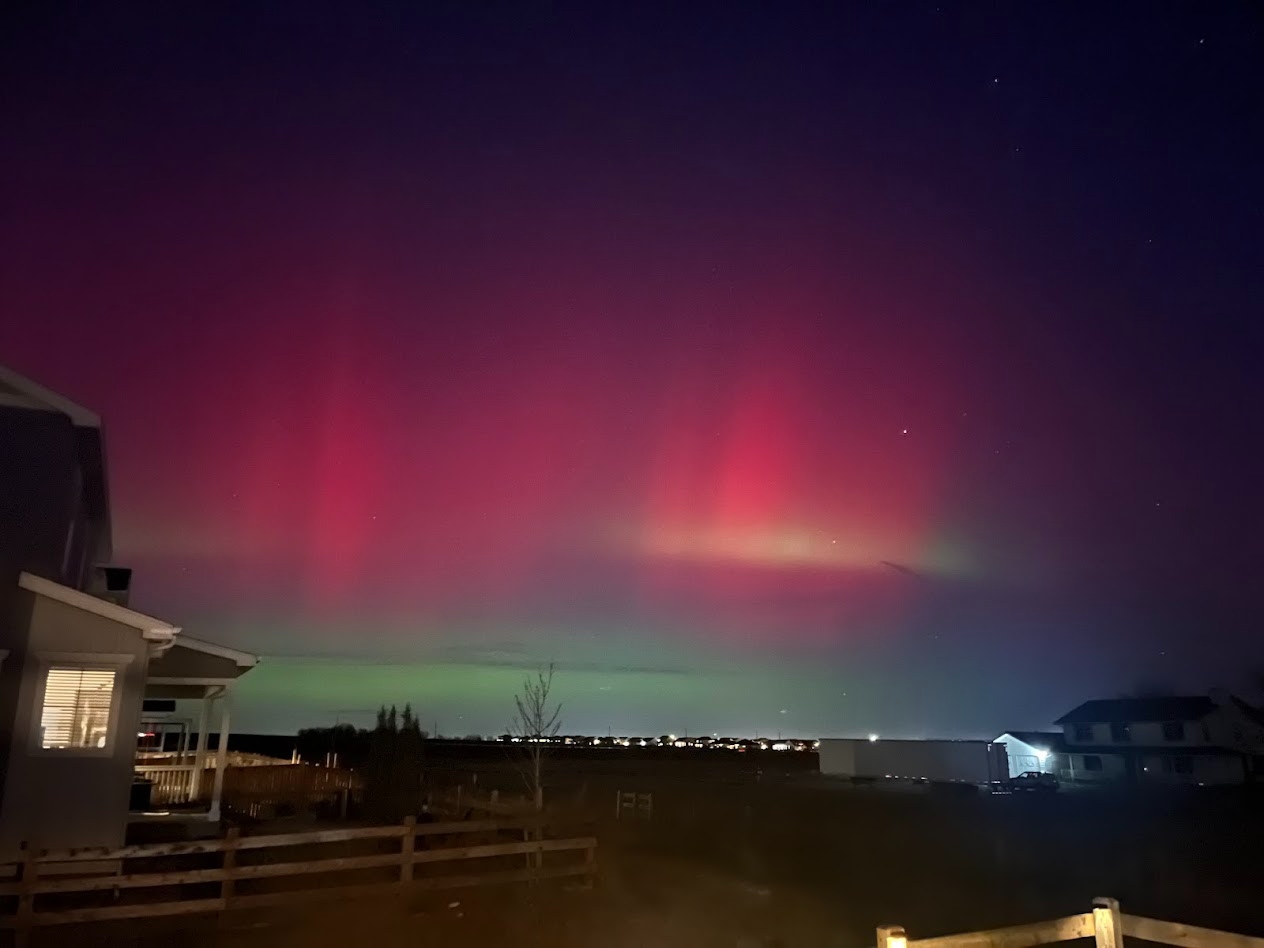 Northern lights visible over the backyard open-space area
